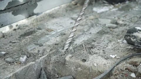 Builder Drills a hole in the wall with a Hammer Drill Stock Footage 263294907