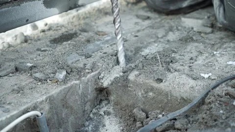 Builder Drills a hole in the wall with a Hammer Drill Stock Footage 263294908