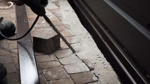 Builder Drills a hole in the wall with a Hammer Drill Stock Footage 263294962