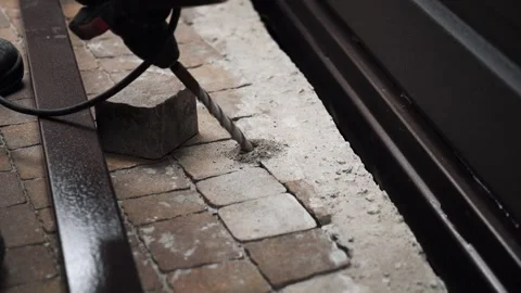 Builder Drills a hole in the wall with a Hammer Drill Stock Footage 263294963