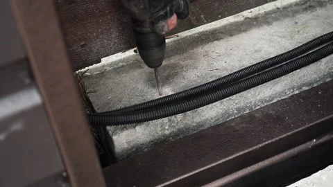 Builder Drills a hole in the wall with a Hammer Drill Stock Footage 263294969