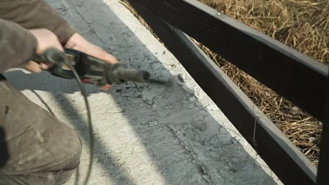 Builder Drills a hole in the wall with a Hammer Drill Stock Footage 269495229