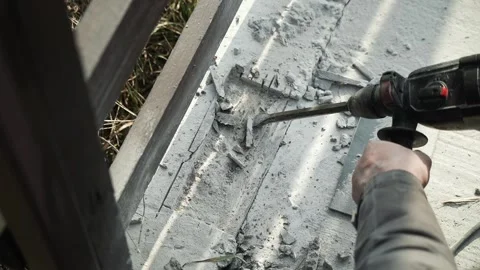 Builder Drills a hole in the wall with a Hammer Drill Stock Footage 269495235