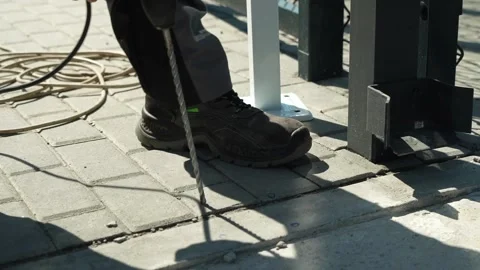 Builder Drills a hole in the wall with a Hammer Drill Stock Footage 277413290