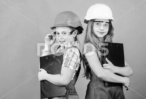 Builder engineer architect. Future profession. Kids girls planning renovation Stock Photos