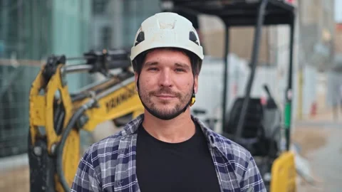 Builder engineer man portrait. Constructor worker look camera construction site. Stock Footage 271221727