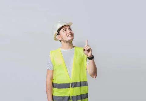 Builder engineer pointing finger to the right isolated, Portrait of enginee.. Stock Photos