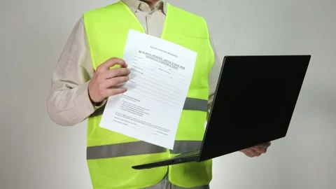 Builder engineer showing with laptop, showing construction document via video Stock Footage 314033602