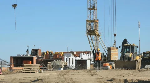 Builder goes to the background construction site Stock Footage 65261057