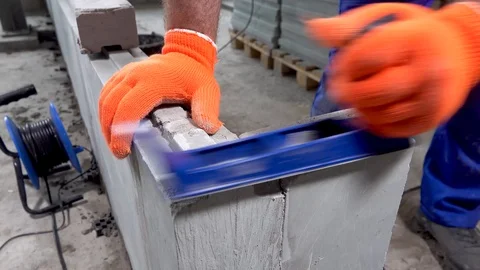 Builder grinds a plasterboard block with a planer, apartment or home repair Stock Footage 115418858