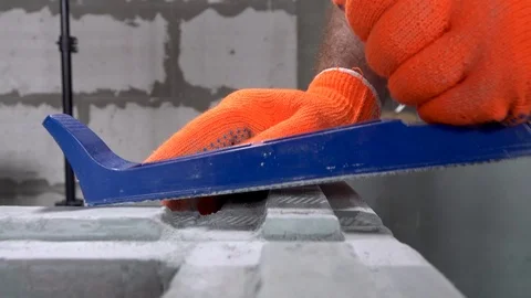 Builder grinds a plasterboard block with a planer, apartment or home repair Stock Footage 115419795