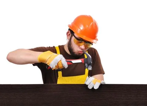 Builder with hammer Stock Photos