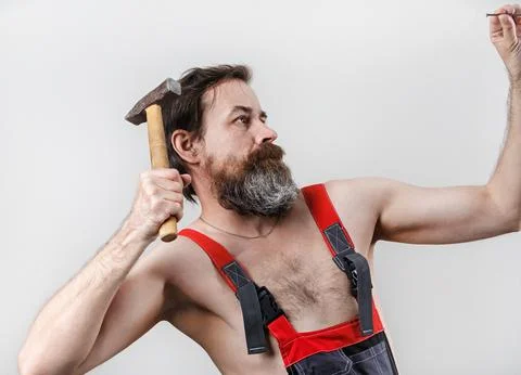 Builder with hammer Stock Photos
