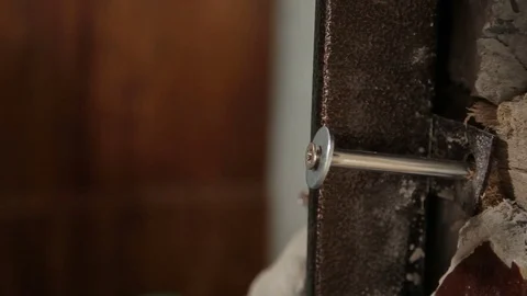 Builder hammering a nail, Mount installs a door frame Close-up Stock Footage 70913823