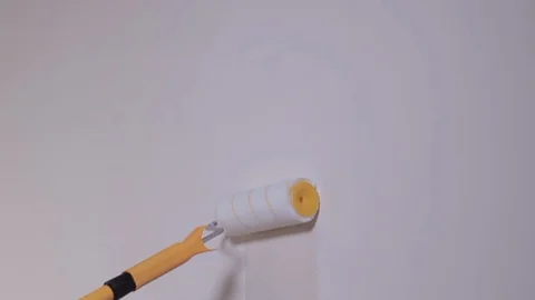 The Builder Hand Strikes The Primer On The Plaster Wall Stock Footage 101388777