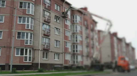 Builder handles the construction seams with foam Stock Footage 66395845