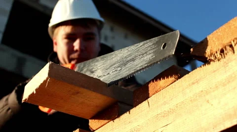 Builder with handsaw Stock Footage 43311241