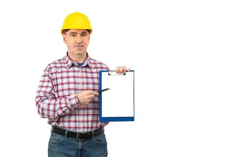 Builder in hardhat is holding a folder over isolated background Stock Photos