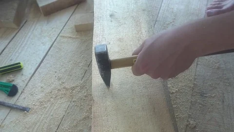 The Builder has a hacksaw on the hammer,an example of how not to work Stock Footage 75912100