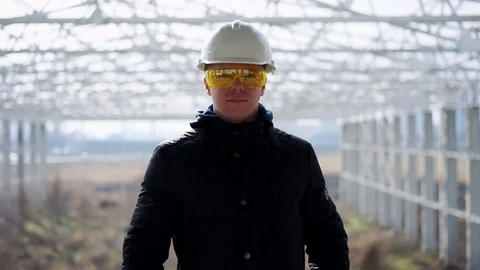 Builder in a helmet on construction object Stock Footage 89707331
