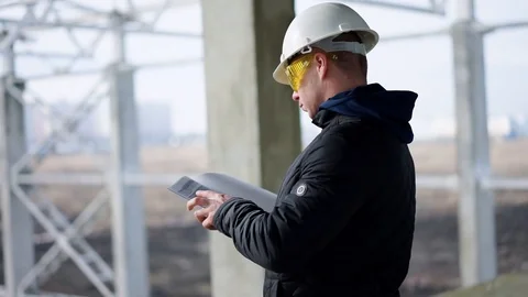 Builder in a helmet on construction object Video stock 89707341