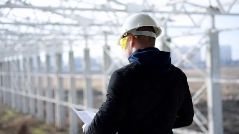 Builder in a helmet on construction object Stock Footage 89707344