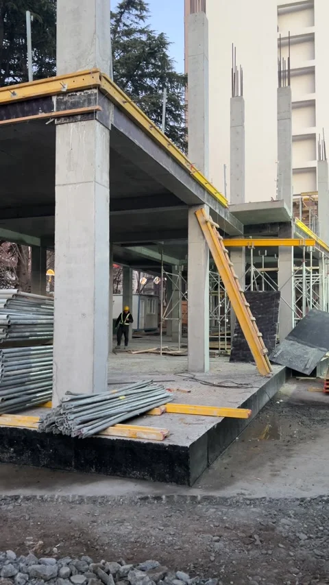 Builder in helmet construction site of new house, building with equipments Stock Footage 297421167