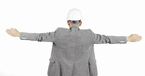 The builder in the helmet raises his hands up and keeps his balance. Stock Footage 86364638