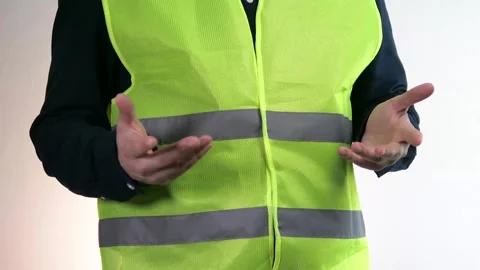 A builder holds a 100 dollars bill in his hands, which disappears in his hands Stock Footage 313122229