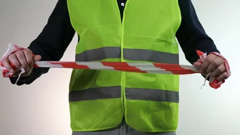 The builder holds a construction tape in his hands. Organization of the Stock Footage 313122573