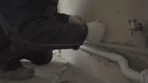 Builder inserts dowels in the wall Stock Footage 101663600