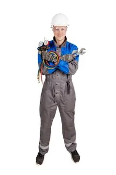Builder, installer of ventilation with tools in hands Stock Photos