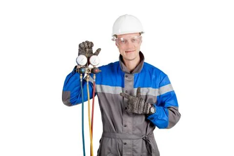 Builder, installer of ventilation with tools in hands Stock Photos