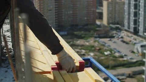 The builder installs the formwork beam Stock Footage 279021001