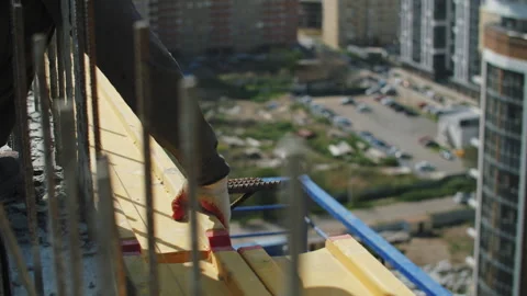 The builder installs the formwork beam Stock Footage 279021044