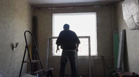 Builder installs a new window. Double glazing. 4K. 스톡 동영상 62082536