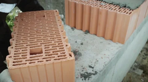 The builder is laying bricks. Close-up shot of laying the bricks. Stock Footage 58264077