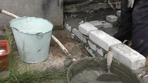 The Builder is laying bricks on the solution Stock Footage 136640000