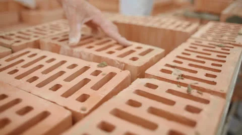 Builder lays bricks on a construction site Stock Footage 24300832