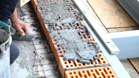 Builder lays bricks on a construction site Stock Footage 63863596
