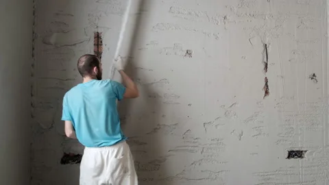 Builder Levels Plaster On Wall. Repair in House. Brick Walls. Surface Recovery Stock Footage 168354859