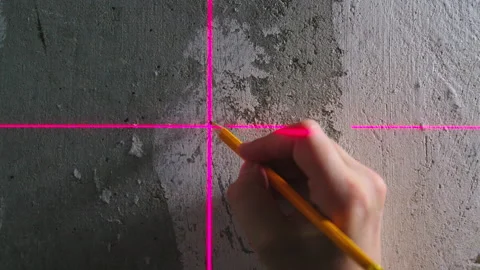 Builder makes markings using laser level. Laser Level and lines on wall Stock Footage 170940040