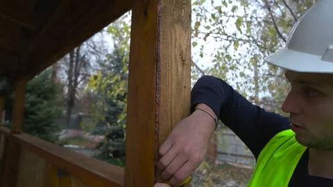 The builder makes measurements close-up Stock Footage 75619266