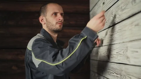 Builder makes measurements with a tape measure Stock Footage 83394305