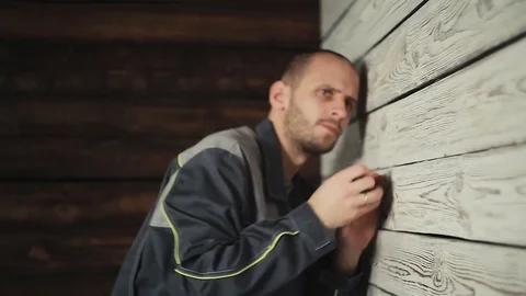 Builder makes measurements with a tape measure Stock Footage 83395045