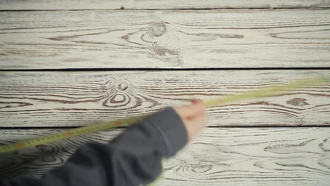 Builder makes measurements with a tape measure Stock Footage 83396945