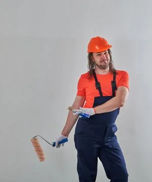 The builder makes repairs in the apartment Stock Photos