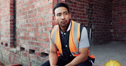 Builder, man and thinking at construction site with lunch break, building Stock Footage 336261077