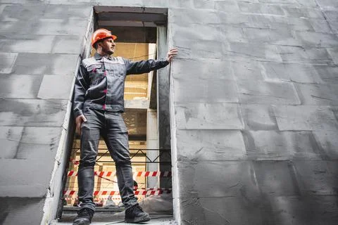 Builder man, construction and people concept. Worker in uniform on the Stock Photos