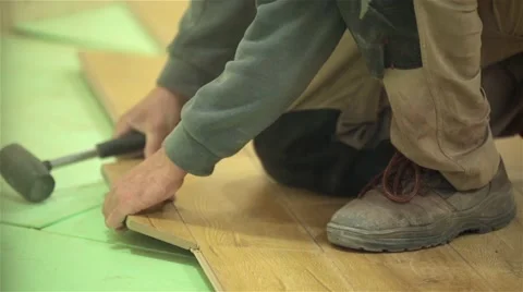 Builder man Install construction house Laying Laminate Floor Video stock 47841005